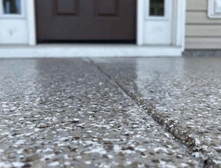 A front porch with an epoxy coating to protect the concrete.