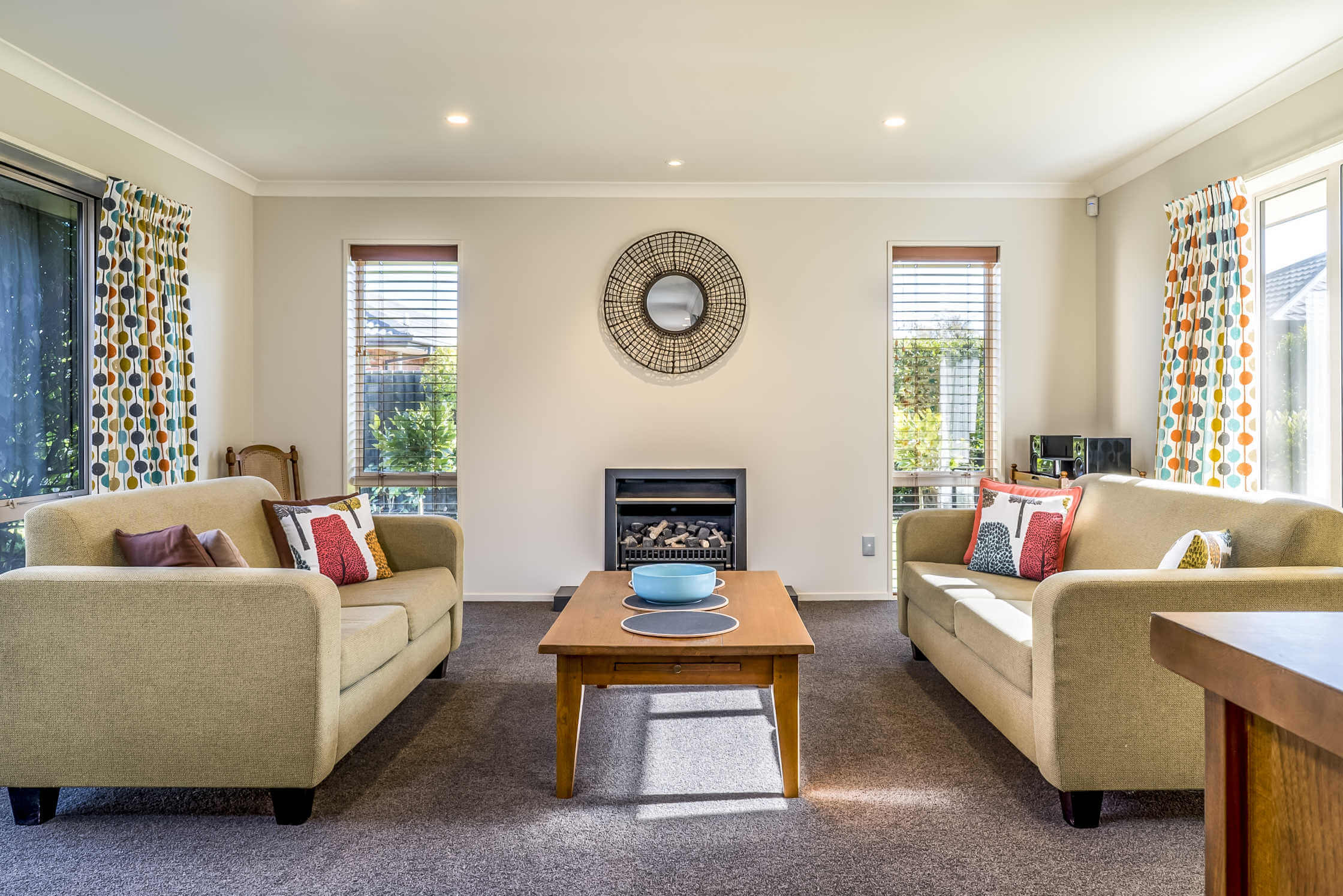A living room repainted to brighten up the area to take it from outdated to fresh and bright.