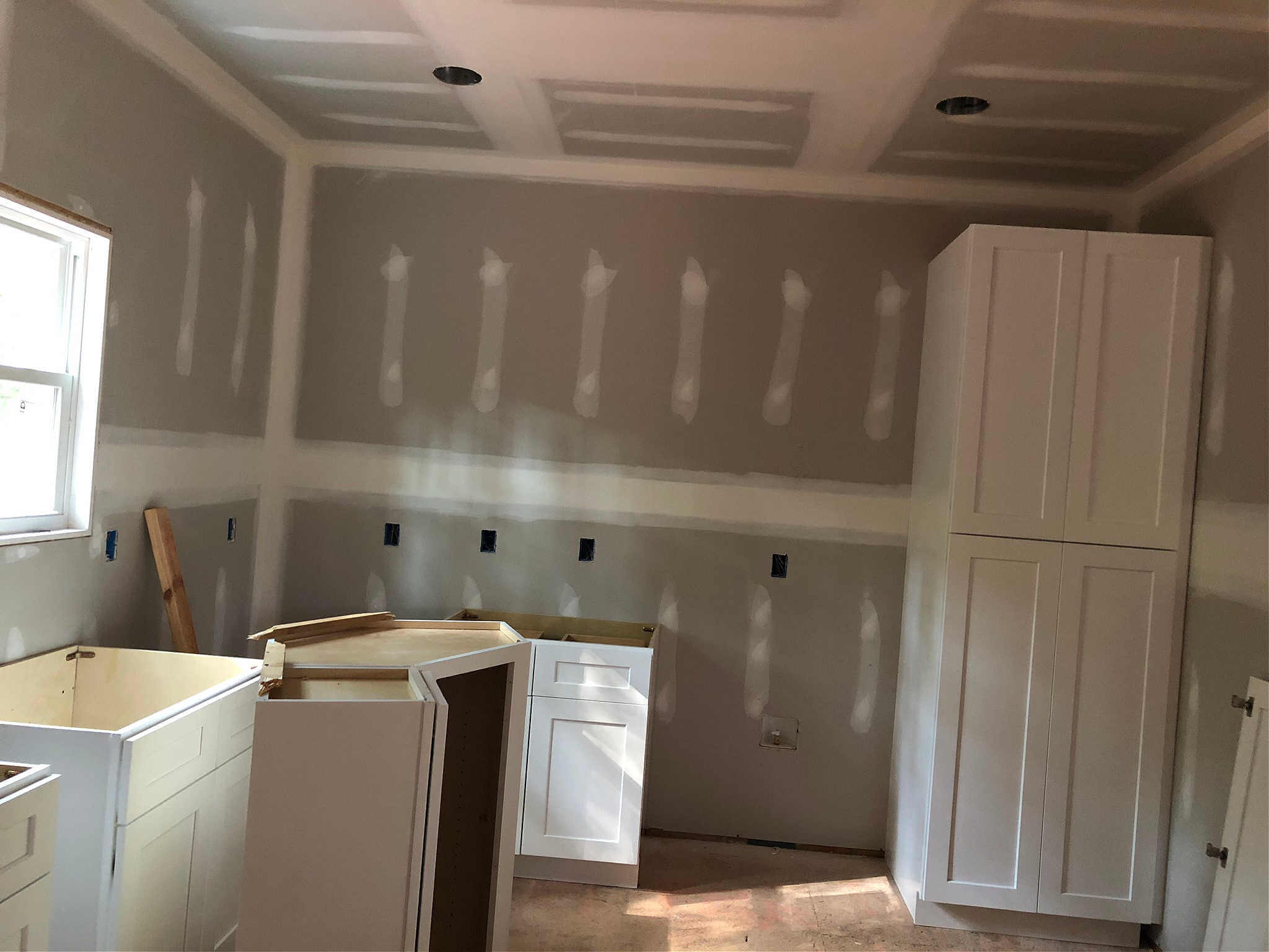 drywall-services-charlotte New construction drywall in a kitchen area.